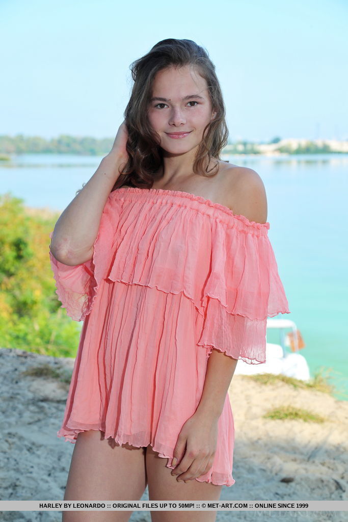 Skinny Young Girl Strips Clothing To Get Totally Naked Near Water